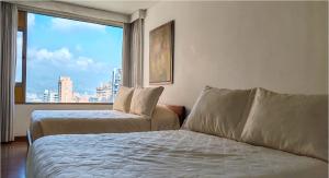 Llit o llits en una habitació de Hotel Casa Victoria