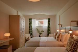 Postel nebo postele na pokoji v ubytování Hotel Lucine