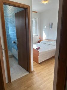 Postel nebo postele na pokoji v ubytování Apartments Šimić