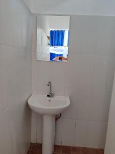 a bathroom with a sink and a mirror at EAST SANDBANK apartment eco-friendly Nungwi airport road in Nungwi