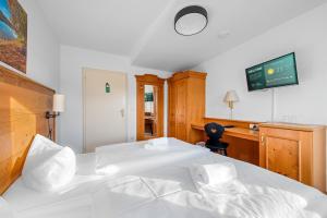 Postel nebo postele na pokoji v ubytování Weidegg - Hotel Garni