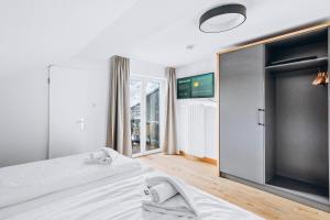 Postel nebo postele na pokoji v ubytování Weidegg - Hotel Garni