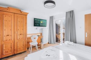 Postel nebo postele na pokoji v ubytování Weidegg - Hotel Garni