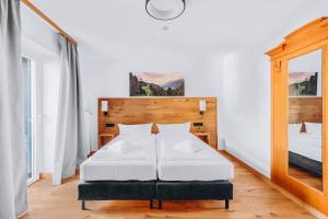 Postel nebo postele na pokoji v ubytování Weidegg - Hotel Garni