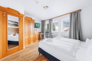 Postel nebo postele na pokoji v ubytování Weidegg - Hotel Garni