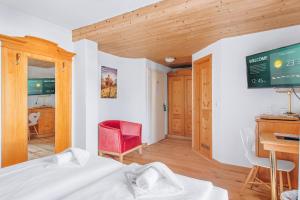 TV a/nebo společenská místnost v ubytování Weidegg - Hotel Garni