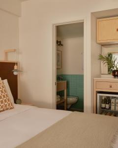 Postel nebo postele na pokoji v ubytování Hotel Lucine