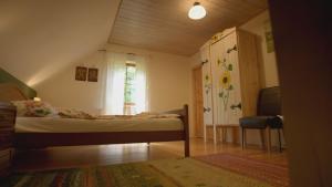 a small bedroom with a bed and a window at Dom na Końcu Świata in Polanica-Zdrój