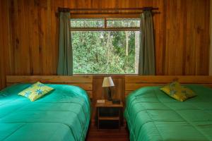 Postel nebo postele na pokoji v ubytování Cala Lodge