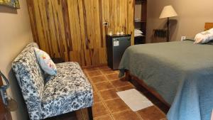 Postel nebo postele na pokoji v ubytování Cala Lodge