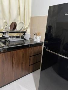 Kuchyň nebo kuchyňský kout v ubytování Pusing Kampung Affordable Homestay