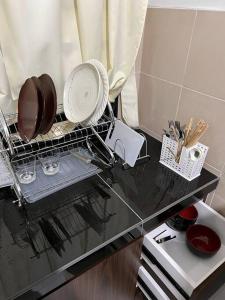 Kuchyň nebo kuchyňský kout v ubytování Pusing Kampung Affordable Homestay