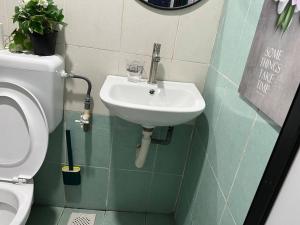 Koupelna v ubytování Pusing Kampung Affordable Homestay