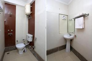 a bathroom with a toilet and a sink at Hotel Luxury Stay Near Us embassy Delhi in New Delhi