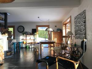 a living room with a table and chairs in it at Huset på berget in Saint-Nizier-du-Moucherotte