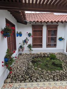 a house with a garden in front of it at Patio Bonito in Jardin