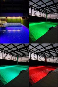 four different views of a swimming pool with green and red wavelengths at Rock Lake Villa in Vagamon
