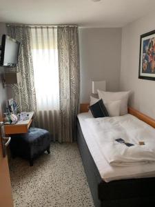 Postel nebo postele na pokoji v ubytování Top Hotel Krämer