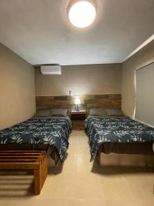 Giường trong phòng chung tại MARYAND