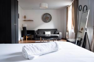 Postel nebo postele na pokoji v ubytování Hôtel Le Tivoli