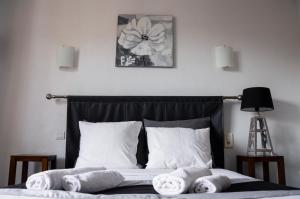 Postel nebo postele na pokoji v ubytování Hôtel Le Tivoli