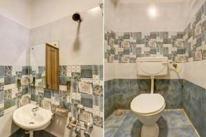 a bathroom with a toilet and a sink at Hotel Saharsh Grand Near Shilparamam in Hyderabad