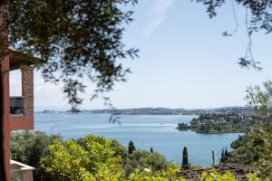 a view of a lake from a house at Swan House - Panoramic View in Kommeno in Kommeno