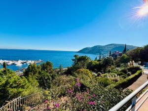 a view of the water from the balcony of a house at Magnifiques appartements vue mer panoramique in Théoule-sur-Mer