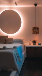 a bedroom with a bed with a large mirror on the wall at Vayu Retreat Villas in Coronado +32 photos