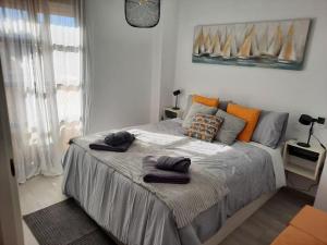 Postel nebo postele na pokoji v ubytování at jardines del mar + 8 fotografií