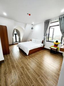 Postel nebo postele na pokoji v ubytování Happy Bun Hotel Da Lat
