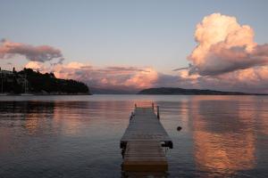 a dock in the middle of a body of water at Villa Rita & Helena in Kalami