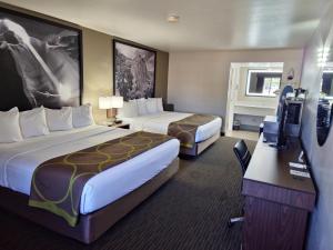 a hotel room with two beds and a television at Super 8 by Wyndham Wickenburg AZ in Wickenburg +38 photos