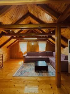 a living room with a couch and a table at Holiday Home Aladin's in Bihać +22 photos