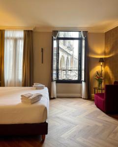 a hotel room with a bed and a window at 286 Piazza San Marco in Venice