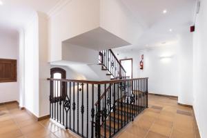 an image of a staircase in a house at Hostal La Muralla in Zahara de los Atunes