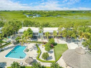 an aerial view of a resort with a swimming pool at Overlooking Lagoon and Pool-Free Golf Cart-Kayaks in Key Largo