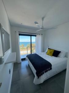 Ένα ή περισσότερα κρεβάτια σε δωμάτιο στο Ocean View Villa - Upper