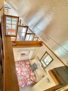 an overhead view of a bedroom in a tiny house at the barn at gallatin farmstead in Red Hook