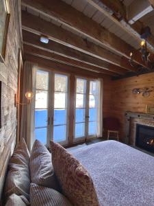 a bedroom with a large bed and a fireplace at Barn & Bike in Red Hook