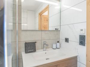 a bathroom with a sink and a mirror at Appartement lumineux avec parking, proche des pistes à Alpe d'Huez - FR-1-645-62 in LʼHuez +9 photos