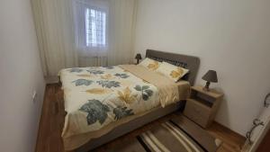 מיטה או מיטות בחדר ב-DIAMOND Ledine Novi Beograd