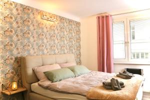 Postel nebo postele na pokoji v ubytování Philux City Apartment