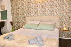 Postel nebo postele na pokoji v ubytování Philux City Apartment