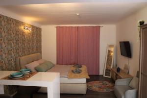 TV a/nebo společenská místnost v ubytování Philux City Apartment