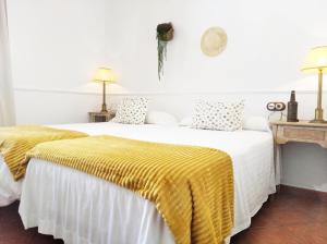 A bed or beds in a room at Casa de abuela Maria