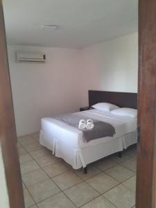 Cama o camas de una habitación en Suítes cambucá