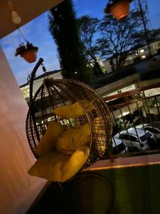 a basket with yellow cushions sitting on a table at Magazi suites 3 in Nairobi