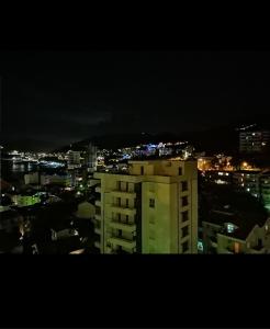 a view of a city at night at Belveder Montenegro in Rafailovici
