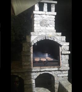 a stone oven with food inside of it at Belveder Montenegro in Rafailovici